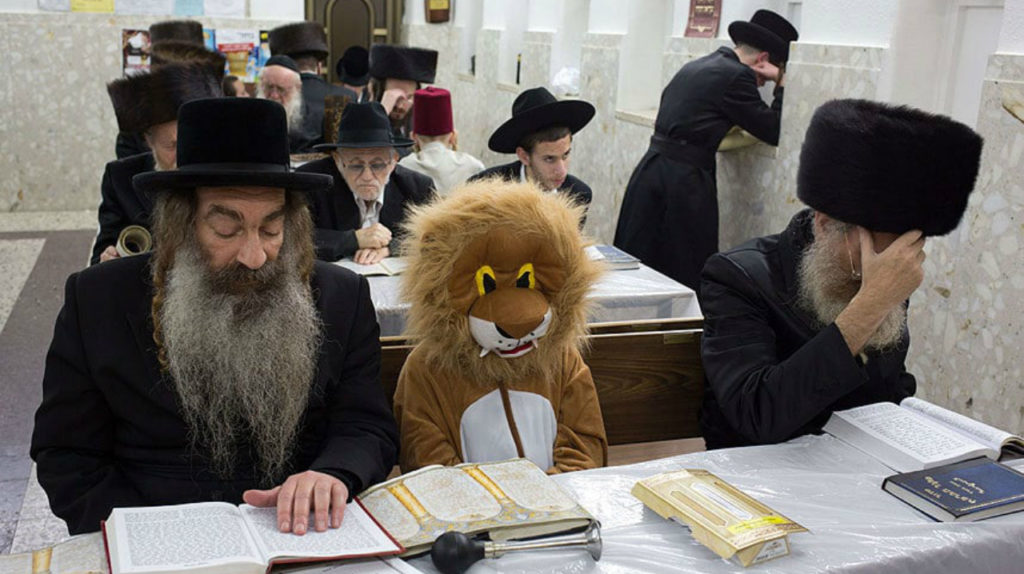 Purim lion costume praying